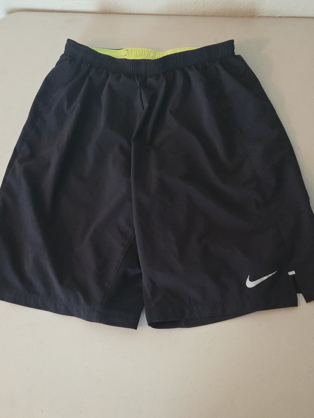Nike Black Athletic Shorts with White Swoosh and Neon Yellow Waistband
